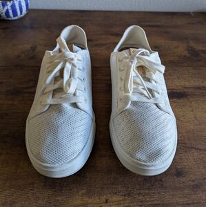 OluKai white sneakers